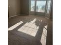 Bright living room with bay windows and carpet flooring at 3575 Oakvale Falls Ct, Decatur, GA 30034