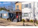 Charming duplex exterior featuring a red door and freshly cut lawn offers inviting curb appeal at 160 Vanira Se Ave # A, Atlanta, GA 30315