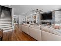 Bright living room with wood floors, a ceiling fan, and a comfortable couch at 160 Vanira Se Ave # A, Atlanta, GA 30315