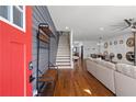 Bright entryway with red door, hardwood floors, and staircase at 160 Vanira Se Ave # A, Atlanta, GA 30315