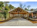 Wooden carport with metal roof attached to home at 5035 Villa Rica Hwy, Dallas, GA 30157