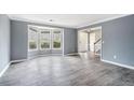 Bright living room featuring bay window and gray walls at 4308 Glenlake Court Northwest, Kennesaw, GA 30144