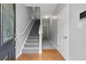 Bright entryway with hardwood floors and carpeted staircase at 3044 Lauren Parc Rd, Decatur, GA 30032