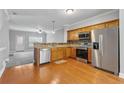 Well-lit kitchen showcases stainless steel appliances, wooden cabinets, and tiled backsplash at 3044 Lauren Parc Rd, Decatur, GA 30032