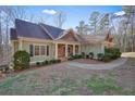 Two story home with a covered porch and landscaping at 159 Geneva Rd, Canton, GA 30114