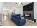 Spacious living room featuring a fireplace and large TV at 200 Wallace St, Fayetteville, GA 30214