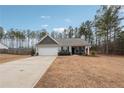 Gray sided house with attached garage and small front porch at 218 Cynthia Ct, Dallas, GA 30157