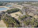 Property surrounded by trees and open fields at 1875 Abbie Ln, Jonesboro, GA 30236
