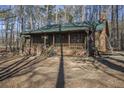 Rustic wooded home with large covered porch at 1875 Abbie Ln, Jonesboro, GA 30236