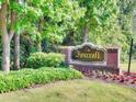 Signage for Foxcroft Condominium, framed by manicured landscaping and lush greenery at 6851 Roswell Rd # N-20, Sandy Springs, GA 30328