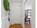 Condo entry with wood floors, white walls, and a glimpse of the living area at 6851 Roswell Rd # N-20, Sandy Springs, GA 30328
