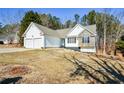 House exterior, two-car garage, and spacious yard at 202 Greentree Trl, Temple, GA 30179