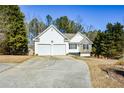 White ranch home with stone accents and driveway at 202 Greentree Trl, Temple, GA 30179