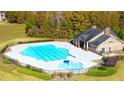 Aerial view of community pool with adjacent clubhouse at 13490 Whitman Ln, Covington, GA 30014