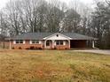 Brick ranch house with a yard at 4890 Prince Se Rd, Smyrna, GA 30082