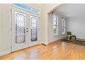 Bright entryway with hardwood floors and double doors at 2155 Washington Dr, Douglasville, GA 30135