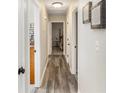 Bright hallway with gray wood-look flooring at 219 Valerie Cir, Hiram, GA 30141