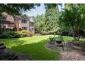 Landscaped backyard with firepit and seating area at 3173 Woodrow Ne Way, Brookhaven, GA 30319