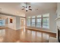 Spacious living room with hardwood floors and fireplace at 1077 Balvaird Dr, Lawrenceville, GA 30045