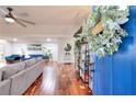 Bright living room with hardwood floors and blue door at 1430 New Hope Church Rd, Loganville, GA 30052