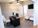 Bright home office features a wood desk, comfortable chair and two monitors at 500 Gristmill Ln, Hampton, GA 30228