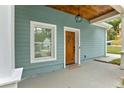 Front entrance with a wood door and a covered porch at 1302 Ladd St, Atlanta, GA 30310