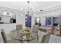 Open dining area with pass-through to the kitchen and seamless transition to the living room at 6851 Roswell Rd # J1, Atlanta, GA 30328