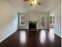 Spacious living room featuring hardwood floors and a fireplace at 85 Kristen Pl, Covington, GA 30016