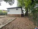 Back of house with a fenced yard and garden at 132 Lamar Nw Ave, Atlanta, GA 30314