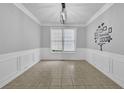 Dining area featuring tile floors, white trim, modern lighting, and natural light at 148 Shady View Pl, Lawrenceville, GA 30044