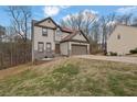 Charming two-story home featuring stone accents, neutral siding, and an attached two car garage at 148 Shady View Pl, Lawrenceville, GA 30044
