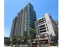 Luxury highrise building with a parking garage and street level retail at 250 Pharr Ne Rd # 607, Atlanta, GA 30305