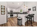 Modern kitchen with white cabinets and quartz countertops at 726 Charlotte Pl, Atlanta, GA 30318