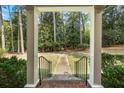 Front porch with white columns and steps leading to walkway at 1790 Garraux Nw Rd, Atlanta, GA 30327