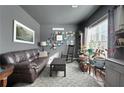Cozy living room with dark gray walls, decorative accents, and ample natural light at 42 Millstone Gln, Dallas, GA 30157