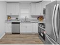 Modern, recently renovated kitchen with stainless steel appliances and sleek countertops at 132 Arnold Pl, Jonesboro, GA 30236