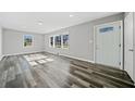 Bright and spacious living area with gray walls and wood-look flooring at 2131 Ben Hill Rd, Atlanta, GA 30344