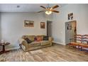 Spacious living area with wood-look floors and ceiling fan at 4162 Samuel Ct, Norcross, GA 30093