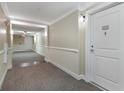 Building hallway with neutral-colored walls and carpeting at 200 River Vista Dr # 330, Atlanta, GA 30339