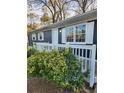 Newly painted blue house with white trim and white picket fence at 212 Valerie Cir, Hiram, GA 30141