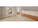 Living room with hardwood floors and neutral walls at 7606 Forest Glen Way, Lithia Springs, GA 30122