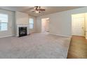 Bright living room with fireplace and neutral carpeting at 2149 Baywood Tree Ln, Snellville, GA 30078