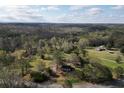 Aerial view showcasing home, expansive land, and surrounding nature at 10170 Cedar Grove Rd, Chattahoochee Hills, GA 30213