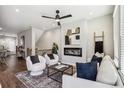 Modern living room with hardwood floors, fireplace, and comfortable seating at 1095 Tucker Ave # 501, Atlanta, GA 30310