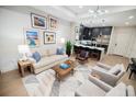 Bright living room featuring hardwood floors and an open floor plan to the kitchen at 40 12Th Ne St # 1701, Atlanta, GA 30309