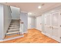 Bright entryway with hardwood floors and staircase leading upstairs at 1735 Peachtree Ne St # 129, Atlanta, GA 30309