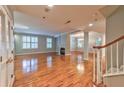 Spacious living room featuring hardwood floors and a fireplace at 1735 Peachtree Ne St # 129, Atlanta, GA 30309