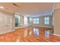 Living room with hardwood floors, built-in shelving, and fireplace at 1735 Peachtree Ne St # 129, Atlanta, GA 30309