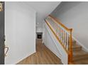 Bright entryway with hardwood floors, staircase, and view of a fireplace at 1004 Masons Creek Cir # 1004, Atlanta, GA 30350