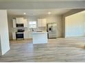 Modern kitchen with white cabinets, island, and stainless steel appliances at 168 Silvercrest Dr, Acworth, GA 30101